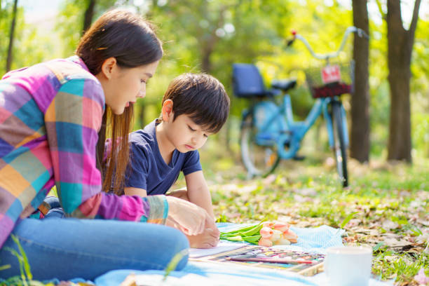 istock Woman and son picnic together. 1485911141