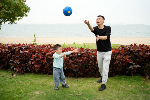 istock Father and son play ball together 1485919868