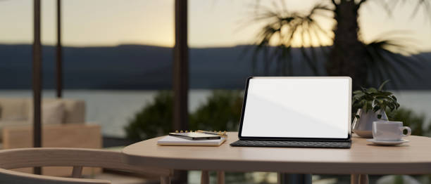 istock A digital tablet white screen mockup on a table in minimal beautiful coffee shop. 1485925023