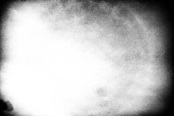 istock A black and white abstract photograph showing a circle with white particles exploding a white halo ring in a wide angle. 1485925803