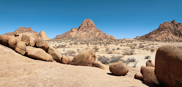 Panoramic view of the giant boulders in the arid desert landscape of Spitzkoppe Namibia