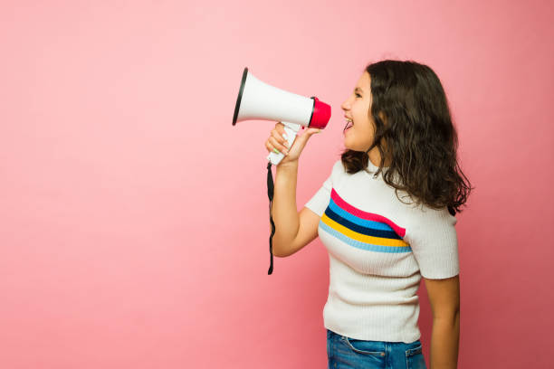 istock Profile of an upset teenager using a megaphone screaming 1485930633