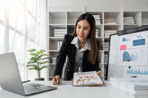 istock Businesswoman working with document on her desk, doing planning analyzing the financial report, business plan investment, finance analysis concept at office 1485930928