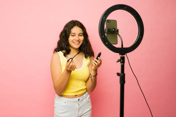 istock Excited teen influencer filming a makeup video tutorial 1485931447