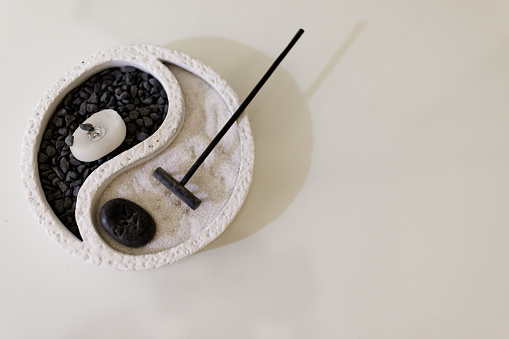 Close-up shot of  Zen garden on white desk without people