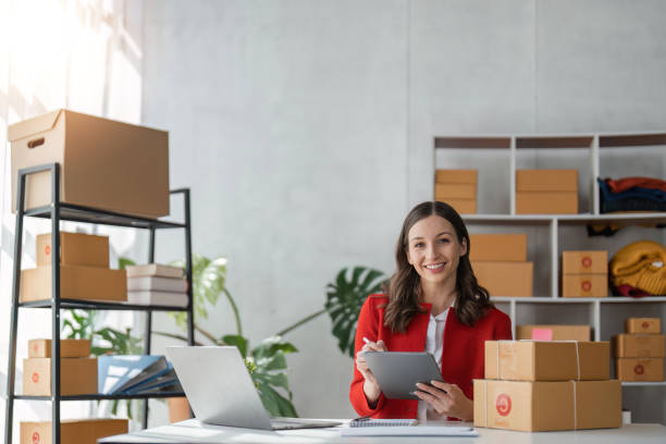 istock Startup small business SME, Entrepreneur owner using tablet taking receive and checking online purchase shopping order to preparing pack product box. Selling online ideas concept 1485937309