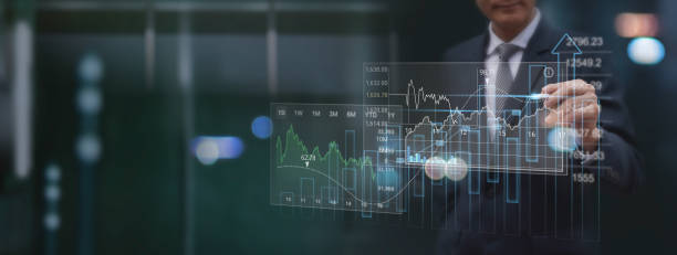 istock Finance analyst analyzing stock market report with financial data, economic graph growth chart on virtual screen with dark background,  Business growth, planing, strategy, finance and investment concept 1485938126
