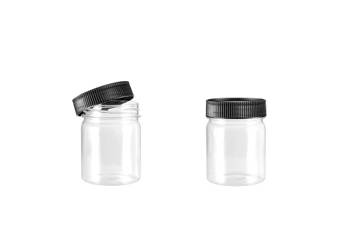 A Round Shape Glass Canister with black metal cap isolated on white background with clipping paths