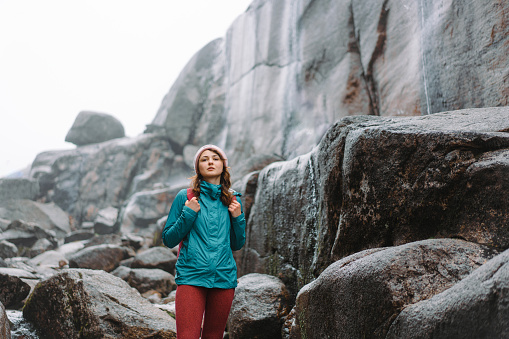 Woman in activewear on the hiking trail  to Kjerag in Norway