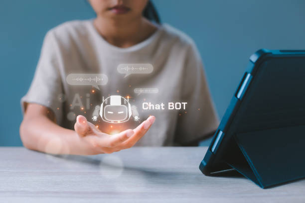 Virtual artificial intelligence digital AI chatbot communicate and interact helping business in hand. Robot application, conversation assistant, Futuristic technology transformation. stock photo