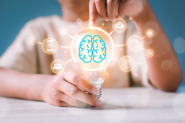 Girl holding light bulb with virtual Artificial Intelligence and virtual digital brain. AI Technology. Searching information data on internet networking, intelligence technology concept. stock photo