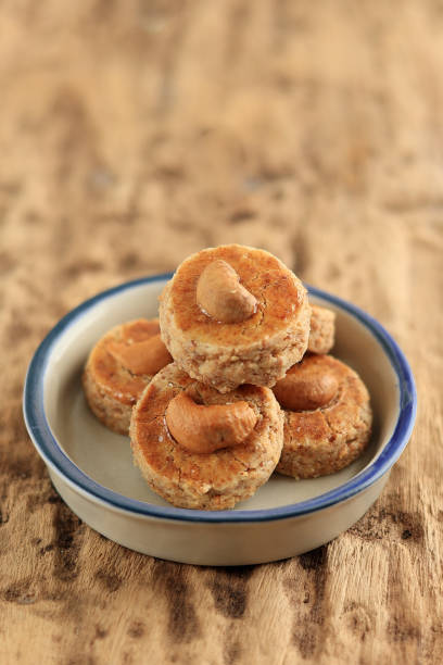 Close Up Peanut Butter Cookies with Cashew Topping, Popular Known as Kue Kacang, Served on Eid Al Fitr