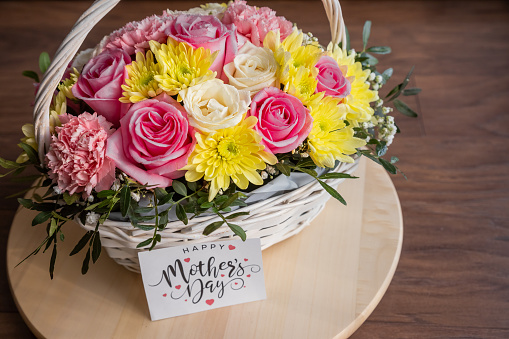 May mothers day handmade giftbox wishes photography - Beautiful blooming carnations with pink ribbon box isolated on fair-faced gray background desk, close up, copy space, mock up