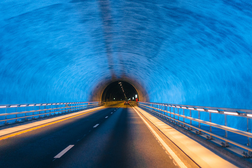 Underwater highway tunnel lit with blue lights in Norway