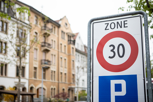 French road sign indicating 50 km per hour speed limit, selective focus