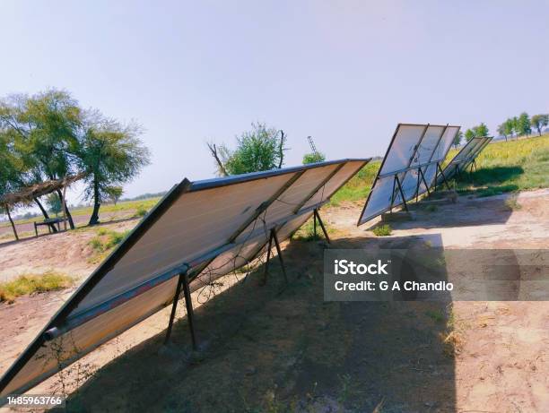 Back Side View Of Solar Panels Installed In Agriculture Field Under Sunlight For Irrigation Tube Well On Solarenergy Paneles Solares Panneaux Solaires Paineis Solares Image Picture Stock Photo Stock Photo - Download Image Now