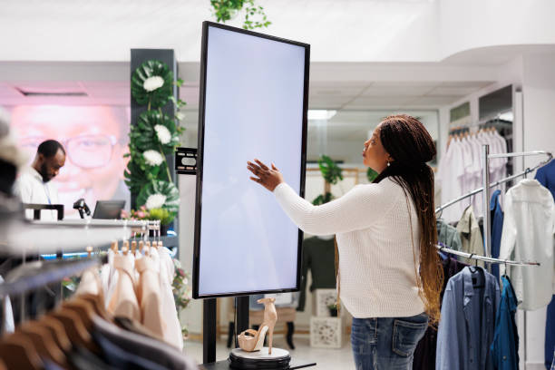 istock woman using smart display board to shop for shoes 1485965383