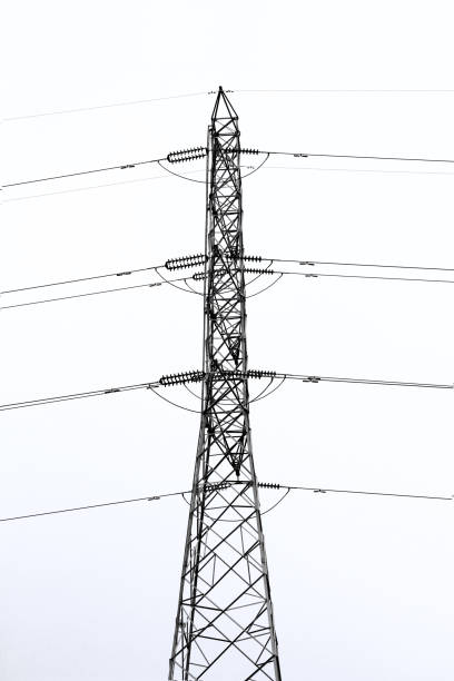 high voltage pole in daylight with cloud sky,electricity distribution station in urban,isolated line of electricity on white background