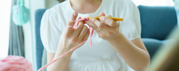 istock Woman making a crochet craft. 1485967643