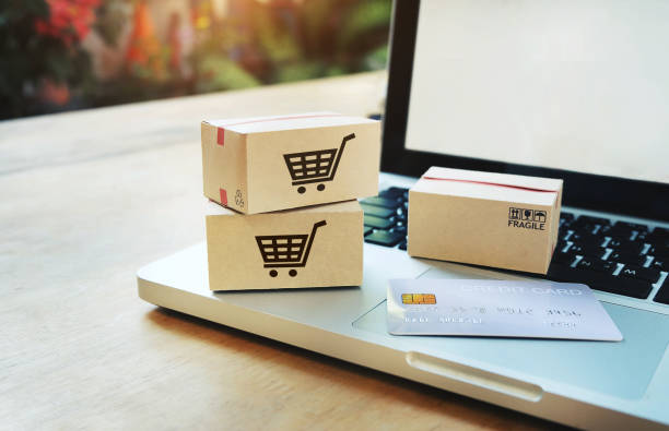 istock Paper boxes on a laptop and credit card 1485967736