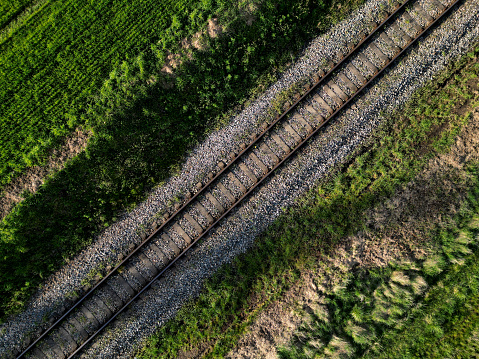 fly over train tracks in the countryside. vertical view of the landscape. background, texture modellers, transport journalists theme. background from above video, sleeper, tie,