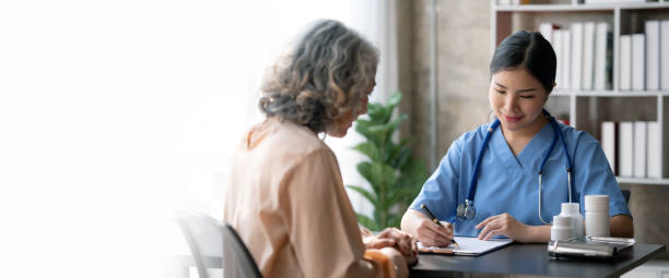 asian female doctor examining a patient to assess the illness for proper treatment. - outpatient imagens e fotografias de stock