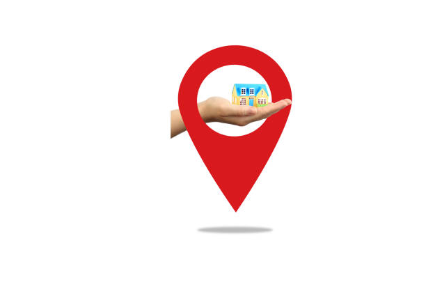 istock Hand holding a model house with red location 1485978384