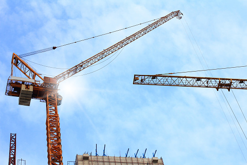 construction site with crane on sky background