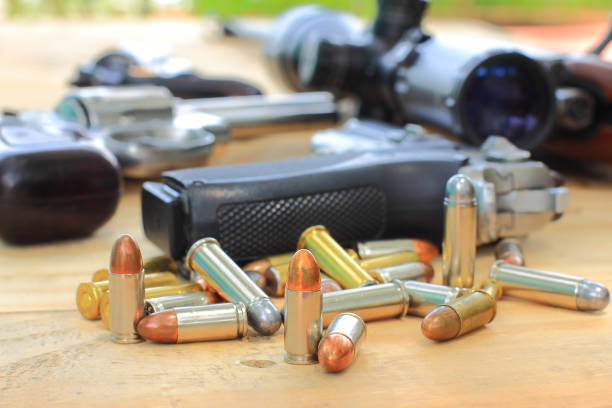 istock Semi-automatic pistol and ammunition placed on wooden table,Preparing equipment for hunting and sporting 1485981478