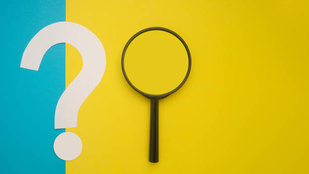 istock A white question mark symbol and magnifying glass are on blue and yellow background. 1485982226