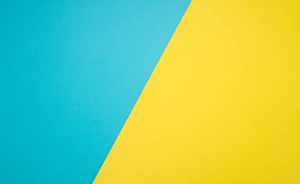 istock Top view of blue and yellow paper background. 1485982607