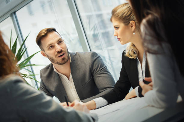 istock Brief business meeting at the office. 1485983779