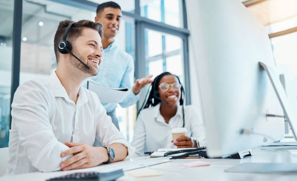istock CRM, call center and telemarketing or about us team during training or coaching with manager on computer in office. Collaboration, teamwork and diversity at customer support agency with good feedback 1485983799