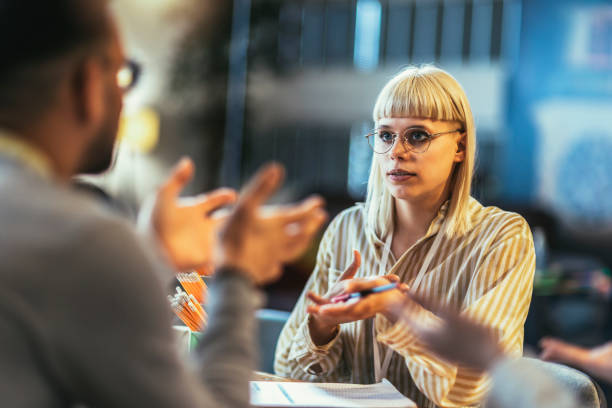 istock Creative young businesswoman sharing her ideas during a meeting in a modern office. 1485984581