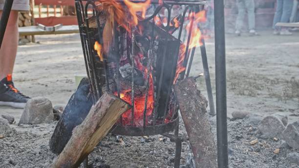 istock Firewood Logs Burning in Barbeque Grill Fire Basket Outdoors 1485985547