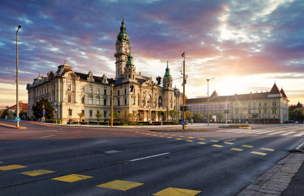 istock Hungary - Dramatic sunset over Gyor town hall with street 1485987737
