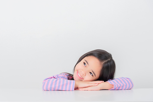 Image of Asian child posing on white  background