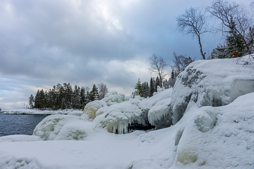 Winter scene. Icicles on the rock.\nHammerfest - Norway.