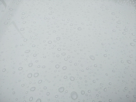 drops of water on glass  background,wet floor and raindrop on hood