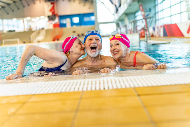 istock Senior people in a swimming pool 1485988828