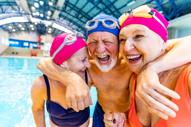 istock Senior friends hugging each other and laughing 1485989996