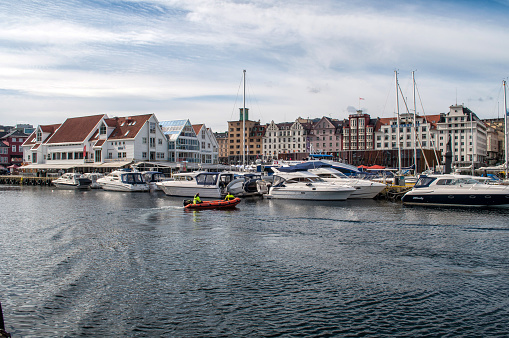 Bergen, Norway - 22 May 2016: Waterfront with a harbor full of boats and yachts in the center of the city.