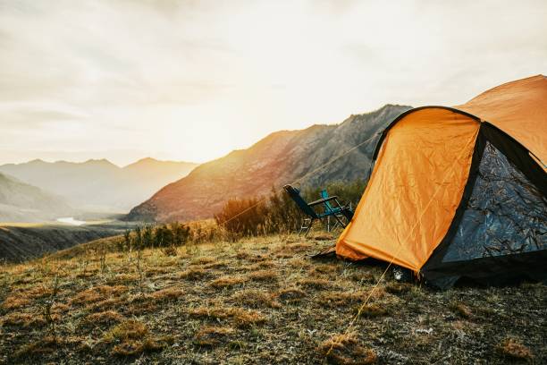 istock Tent in the mountains at sunset 1485992315