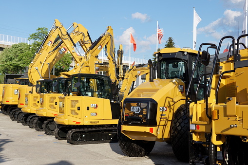 Belgrade, Serbia - April 25, 2023 - Caterpillar (CAT) machinery for construction at the 2023 International Building Trade Fair.  CAT offers bulldozers, excavators, and other heavy equipment.