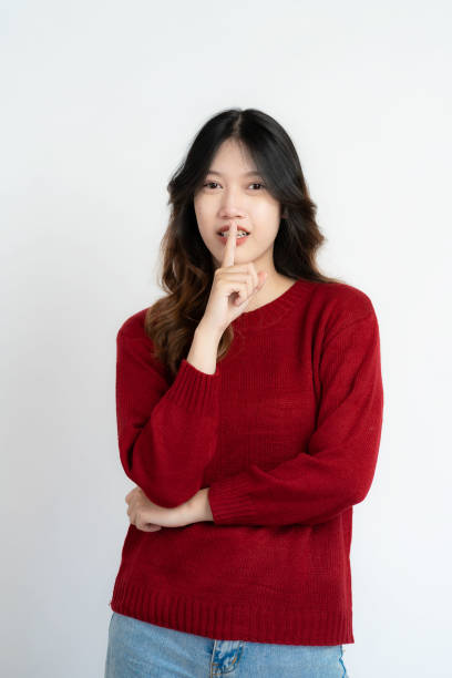 istock Attractive Asian beautiful woman standing on white background and doing hand gestures. 1485994529