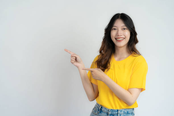 istock Attractive Asian beautiful woman standing on white background and doing hand gestures. 1485994805