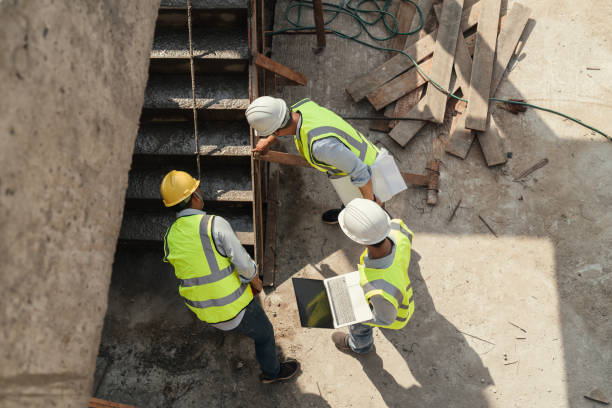 istock Top view, Team civil engineer inspection concrete pouring make stair at construction site. 1485996613