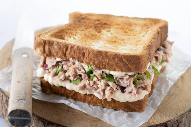 istock Tuna sandwich with mayo and vegetables on white marble 1485998550