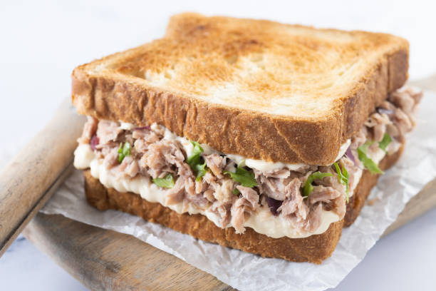 istock Tuna sandwich with mayo and vegetables on white marble 1485998570
