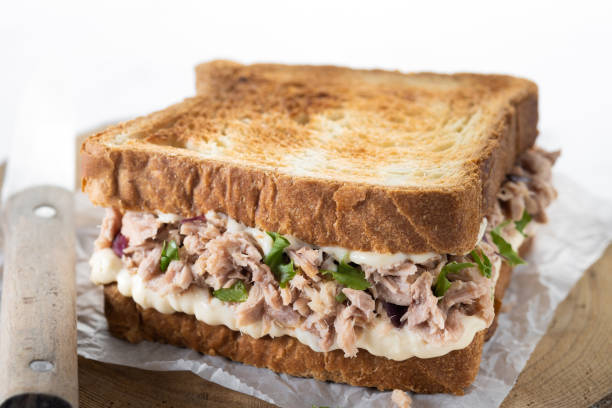 istock Tuna sandwich with mayo and vegetables on white marble 1485998602